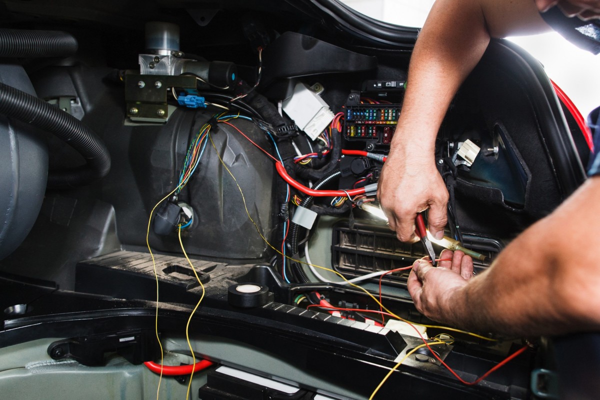 mechanic running diagnostics on a vehicle