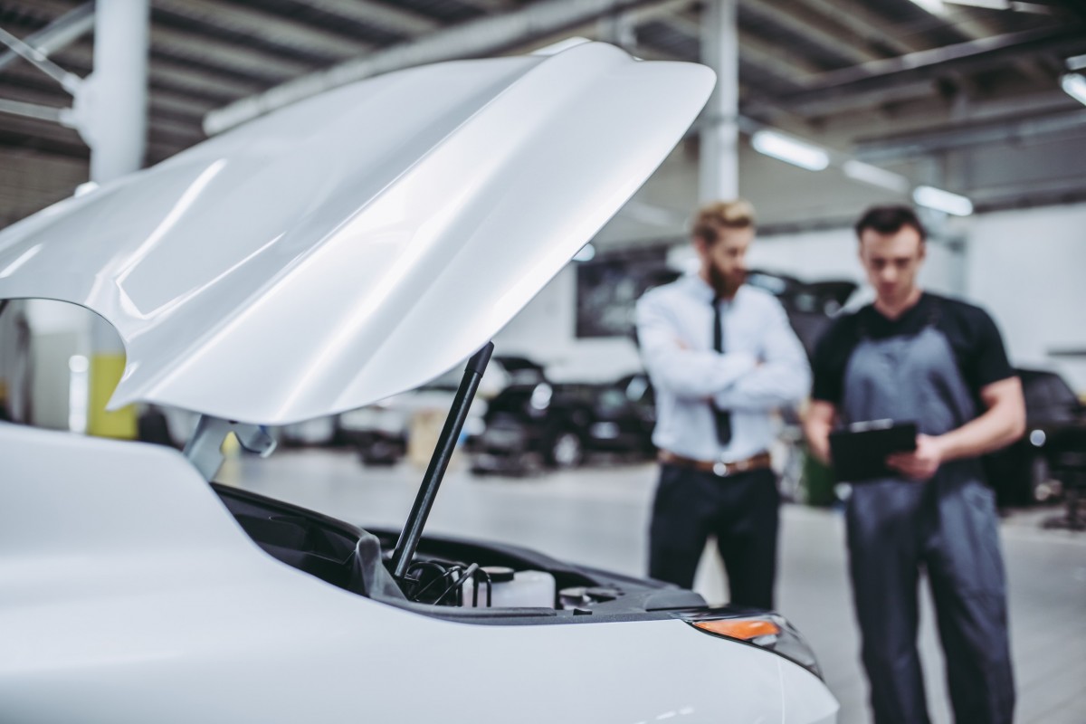 mechanic talking to a customer